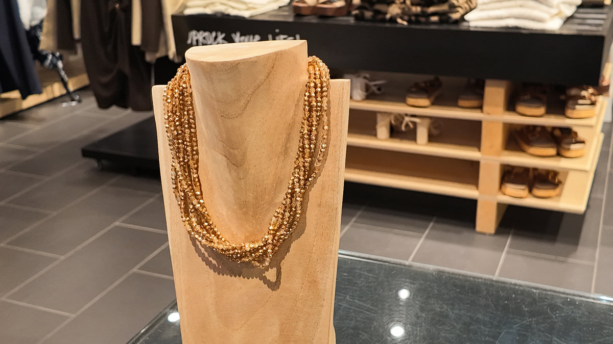 Collier torsadé doré à cordon et pompons – ZEYNAYA PRESTIGE